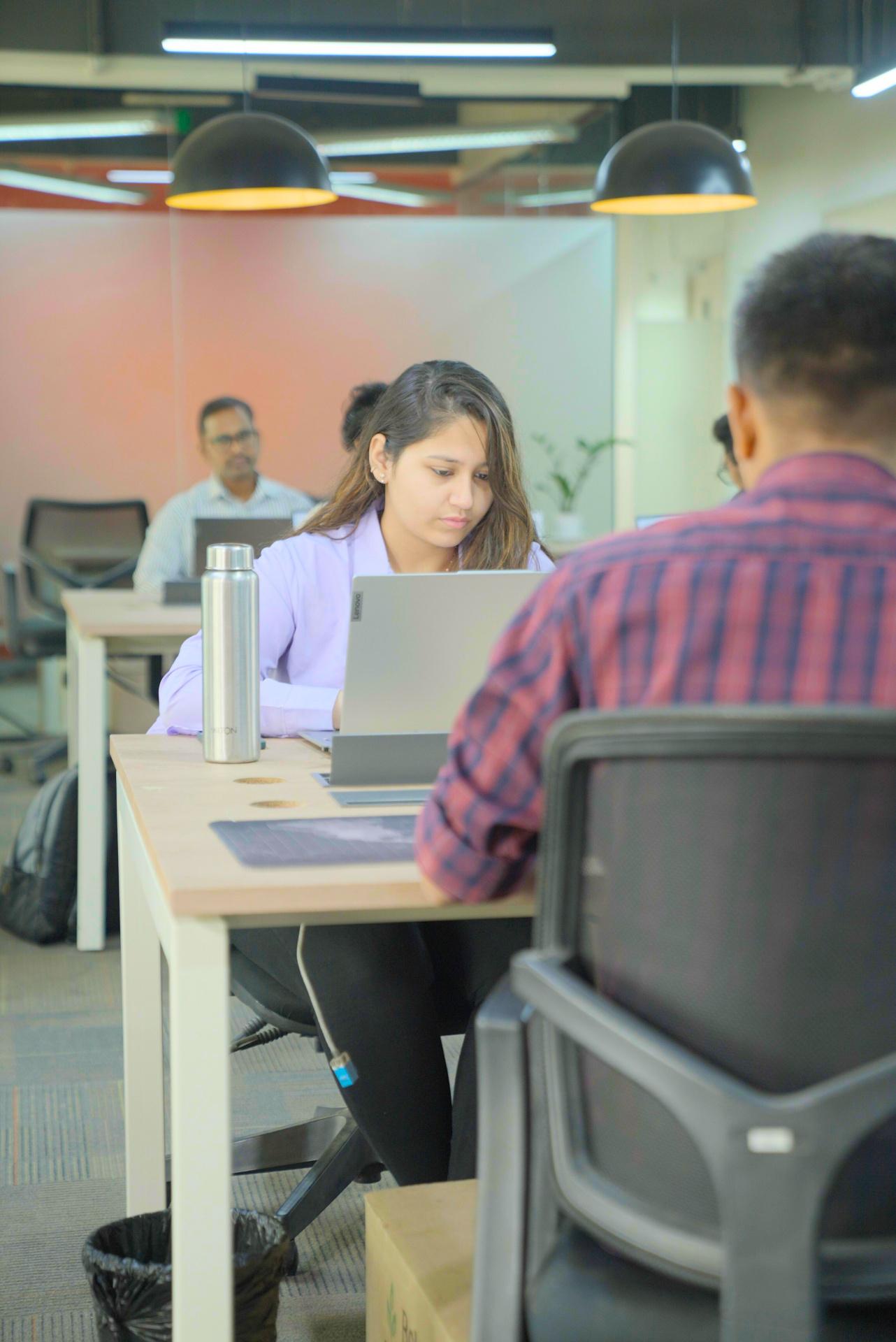 Focused team member working at their desk